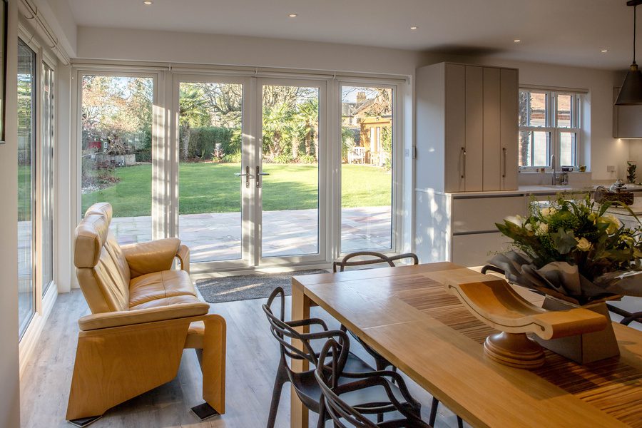 a living room with a table and chairs